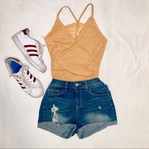 Yellow spaghetti strapped bodysuit